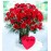 Red roses  with heart shape chocolate box.